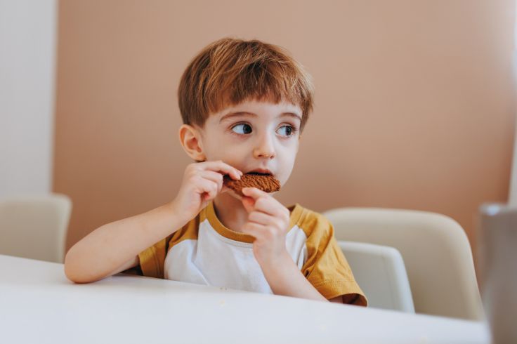 Child eating food on the table