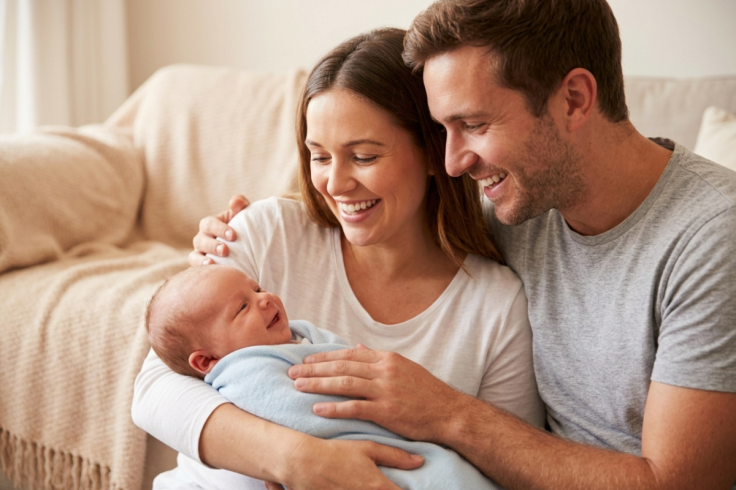 Parents Holding Healthy Newborn Baby