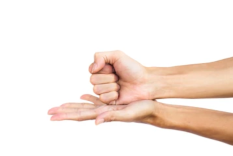 A person demonstrates a sequence of hand movements.