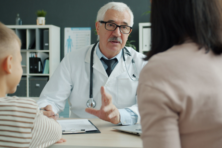 Doctor consulting with patient