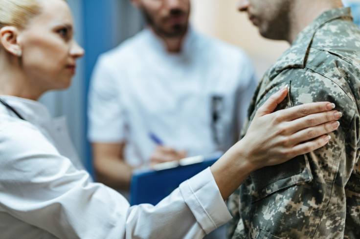 soldier consoled by healthcare worker