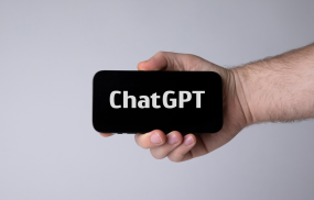 Hand holding smartphone with ChatGPT